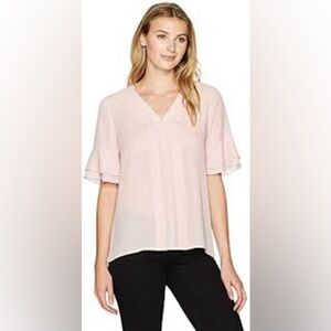 Ivanka Trump blush colored blouse
